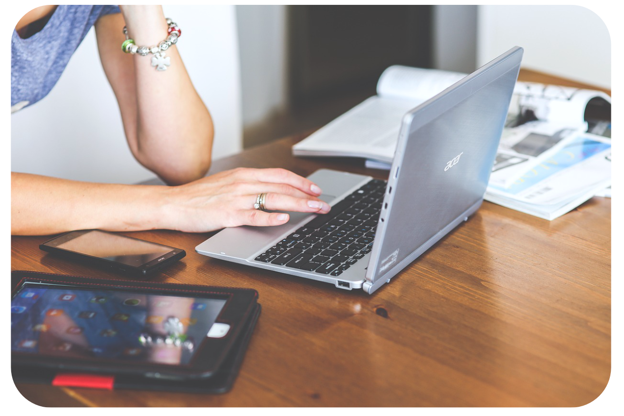 Womans hands over a laptop